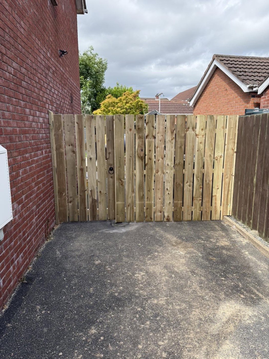 Completed timber gate and fence repair at a property in Lisburn